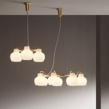 Elaetor Ring Crown Chandelier Shade: Mouth-blown & 3-layered & Opal Glass. Pendant Suspension: Untreated Brass & Will Patinate 21.7"W x 21.7"D