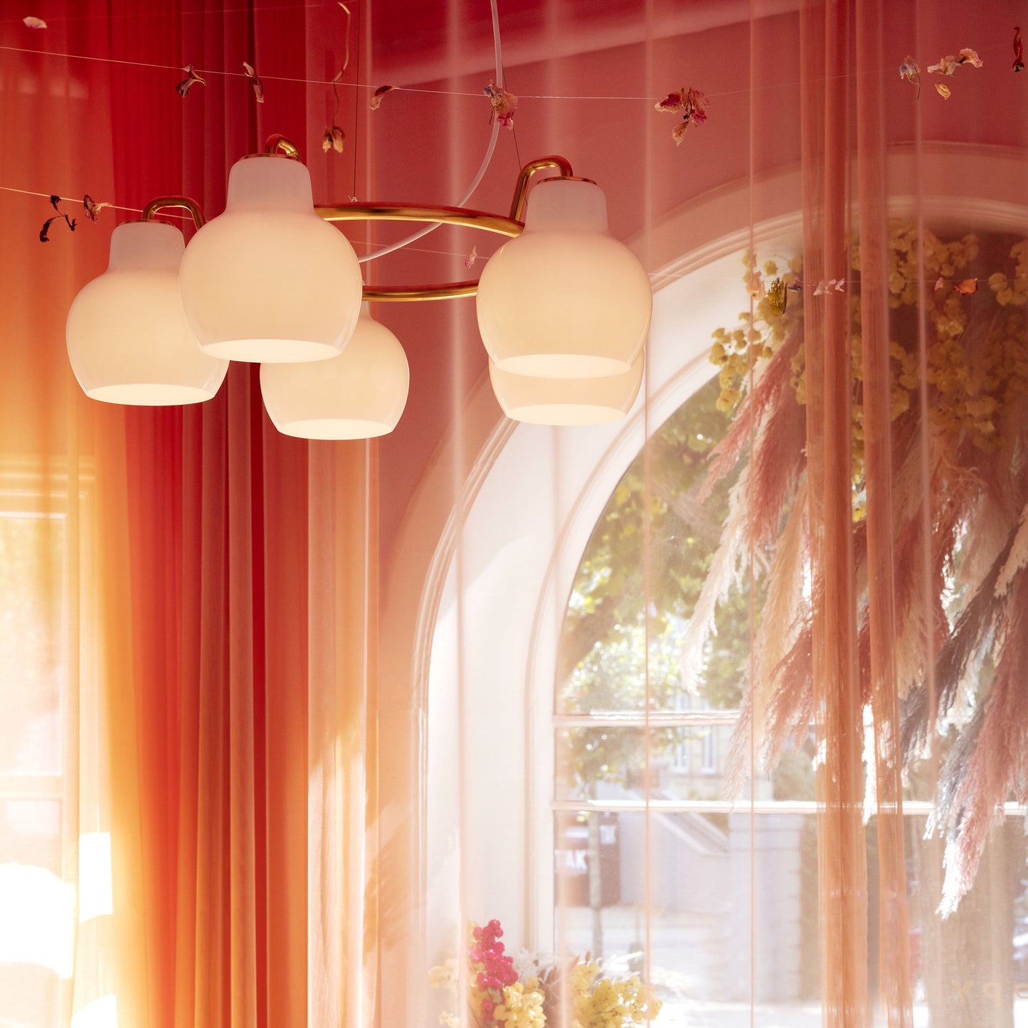 Elaetor Ring Crown Chandelier Shade: Mouth-blown & 3-layered & Opal Glass. Pendant Suspension: Untreated Brass & Will Patinate 21.7"W x 21.7"D